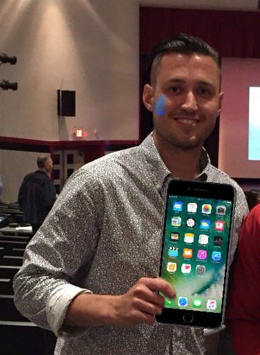 Mr. Nowicki poses with his iPhone prior to deleting all of his apps. His first time ever without social media, he was devastated. 