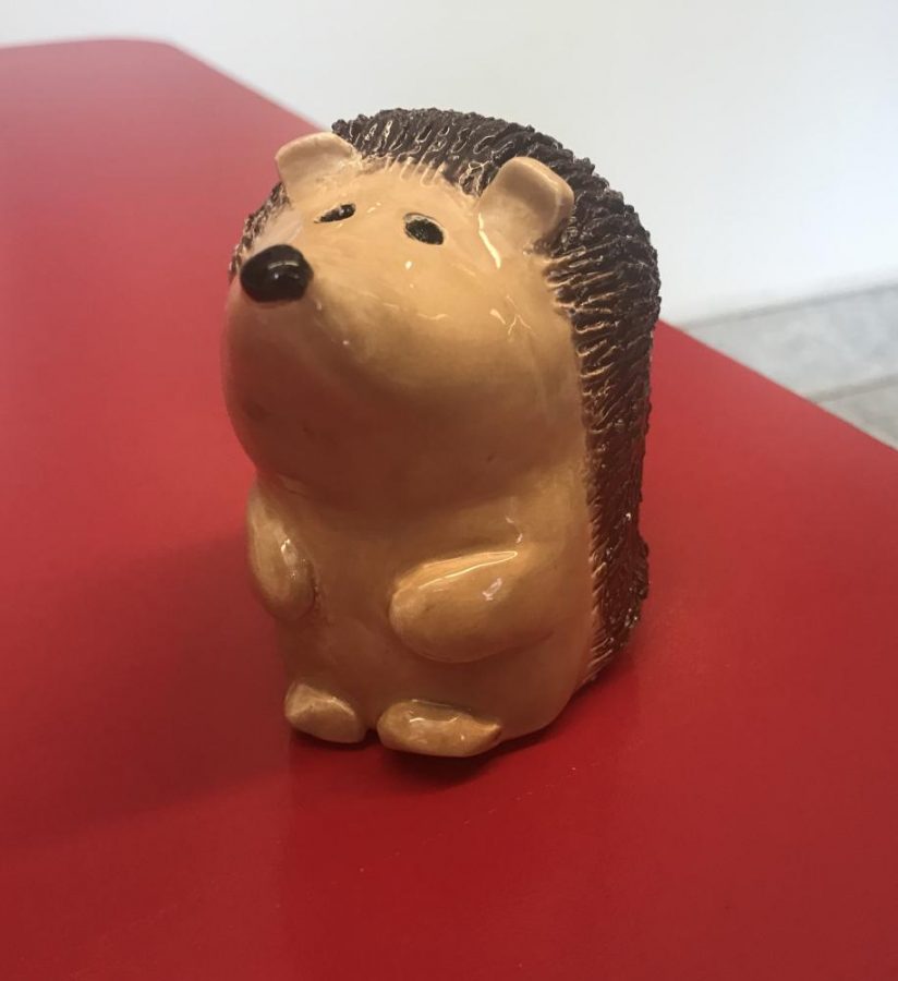 Krista Kuchie, grade 12, creates a ceramic hedgehog. Hermit Hermes, the hedgehog, was chosen to be displayed in the front foyers case. 