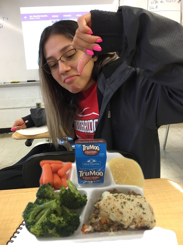 A WHS student shown above with school lunch. The conclusion has been reached that school lunch is gross.