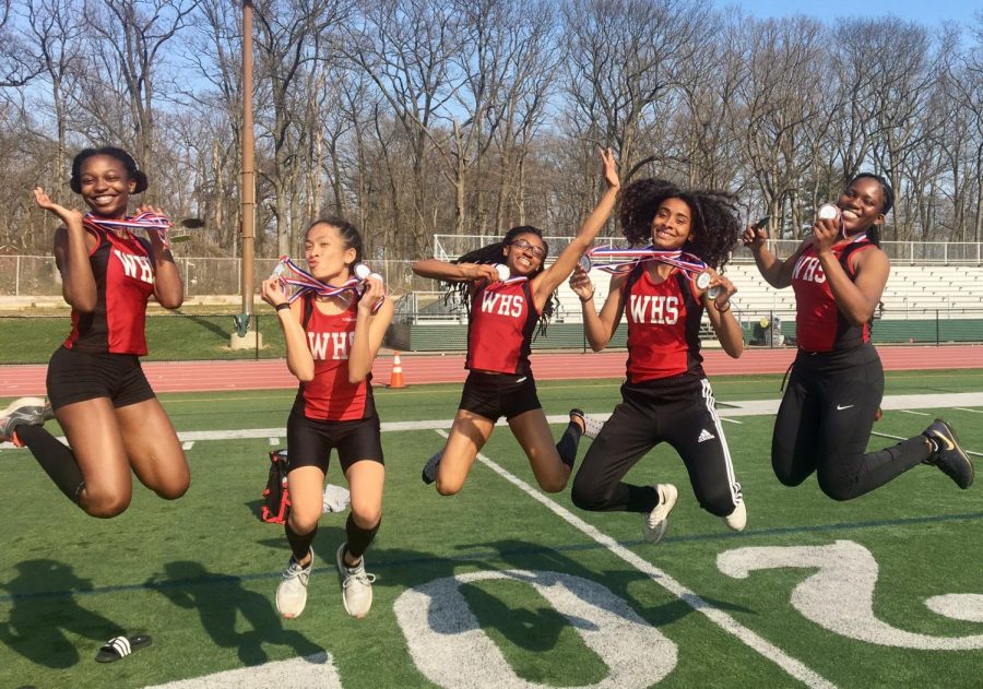 (Left to right) Trinity Eason, Catherine Catipay, Janice Igbinobaro, Kaylah Davis, Taiwo Ibironke jump azfter a successful meet during the weekend. The track team now qualifies for Nationals in the 800 m sprint medley relay. 