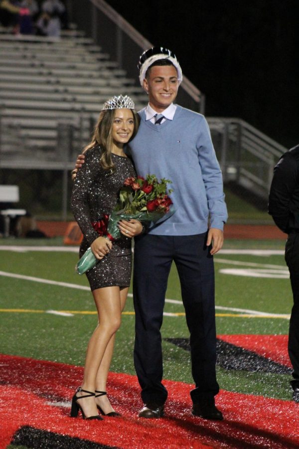 Ryan Vasquez and Nia Rosato posing for a picture after being crowned Homecoming King and Queen during the Woodbridge High School annual Homecoming game. 