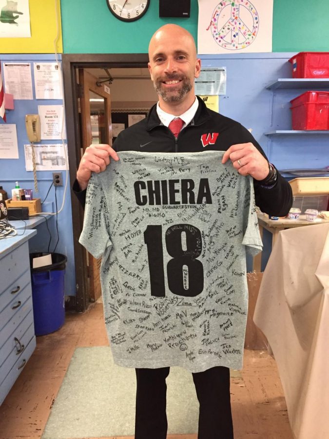Mr. Chiera poses with a special parting gift from the staff at WHS. His last official day as vice principal was March 29th.