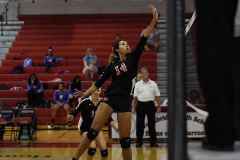 Millie is setting up to spike the ball. She had 94 kills throughout the season. 