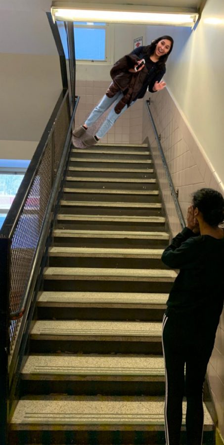 Kaitlyn Pinto watches as Mishal Hakki tumbles down the stairs to the third floor. Many heroes and cool kids have suffered because of exhaustion.