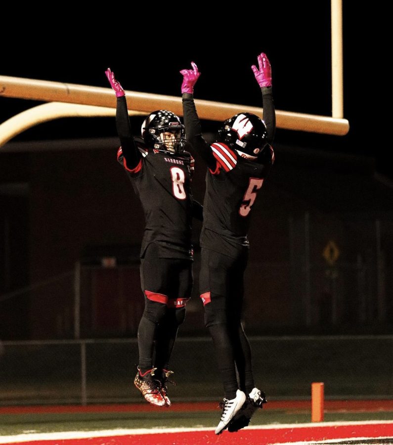 A.J Bosch celebrates with Bryan Anderson after scoring a touchdown.