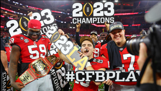 Georgia Celebrating with the College Football Championship trophy after their win over TCU.