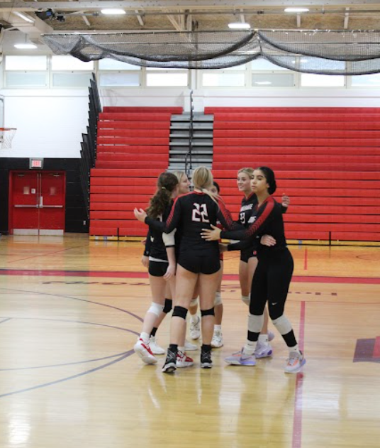 Girls volleyball playing against Old bridge 