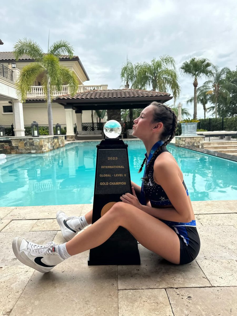 Danielle Mohr (11) with her second consecutive world championship trophy.