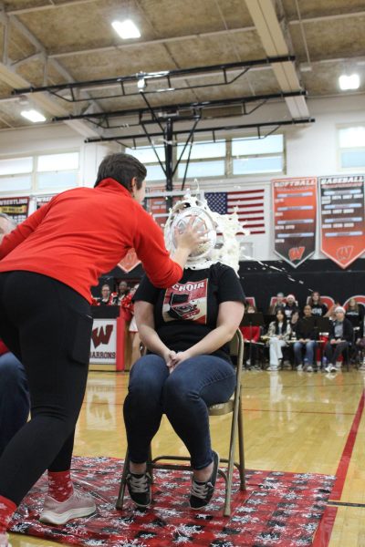 Ms. Romero gets hit with a pie at the Winter Pep Rally
