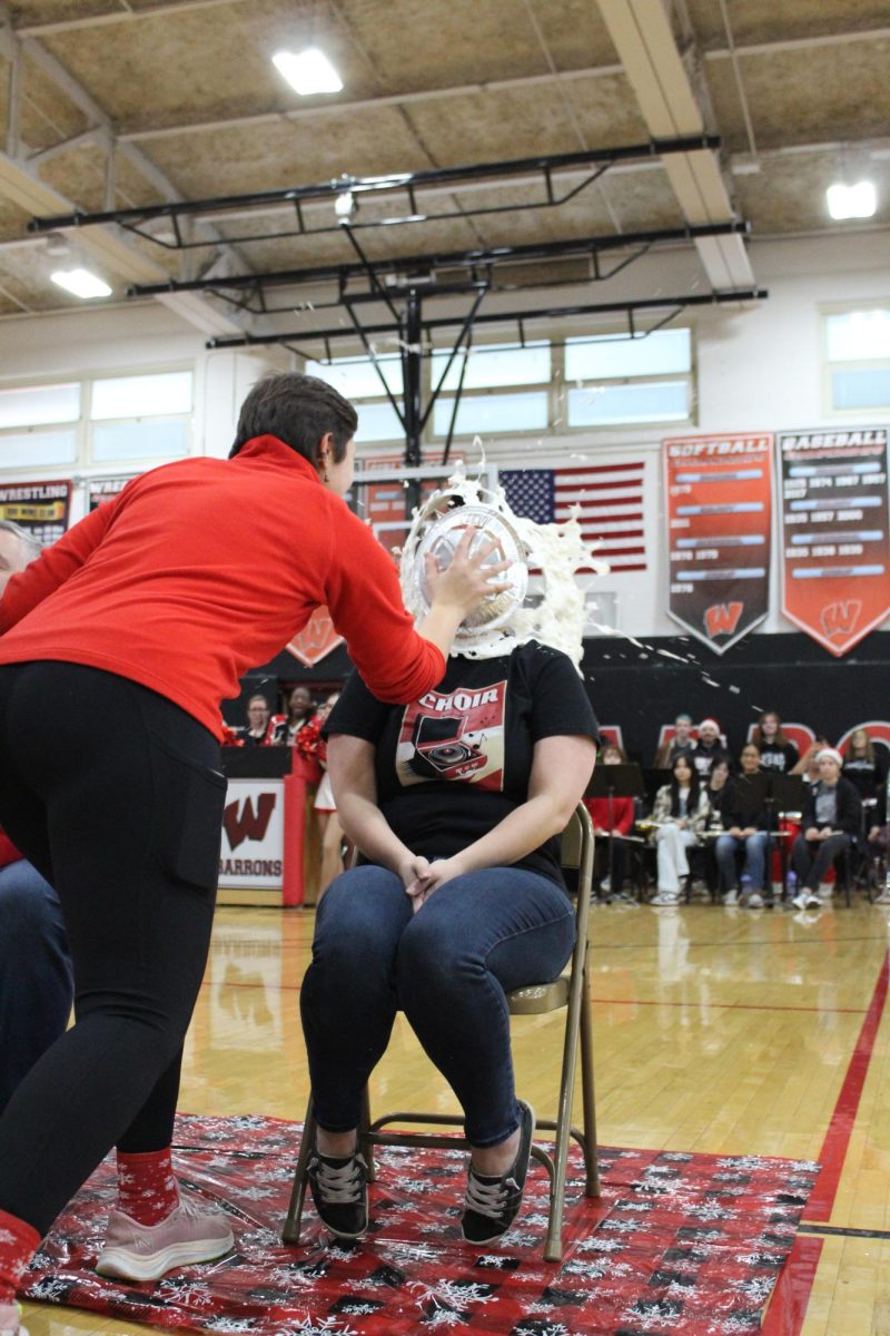 Ms.+Romero+gets+hit+with+a+pie+at+the+Winter+Pep+Rally