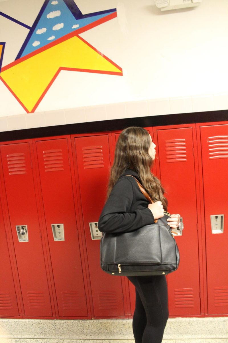 A student poses with a bag that wouldn't be permitted 