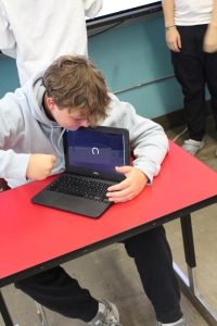 A student struggles with their Chromebook