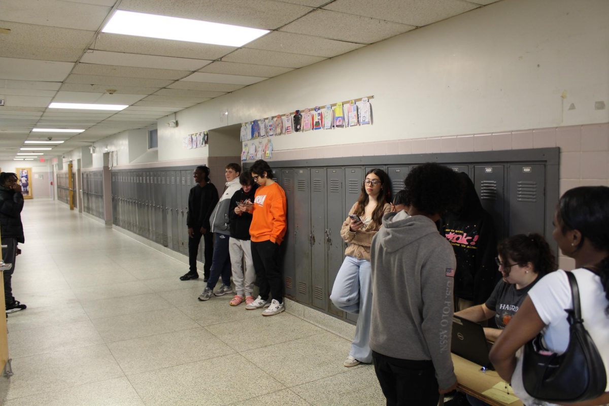 Students wait in line for one of the bathrooms during the school day.