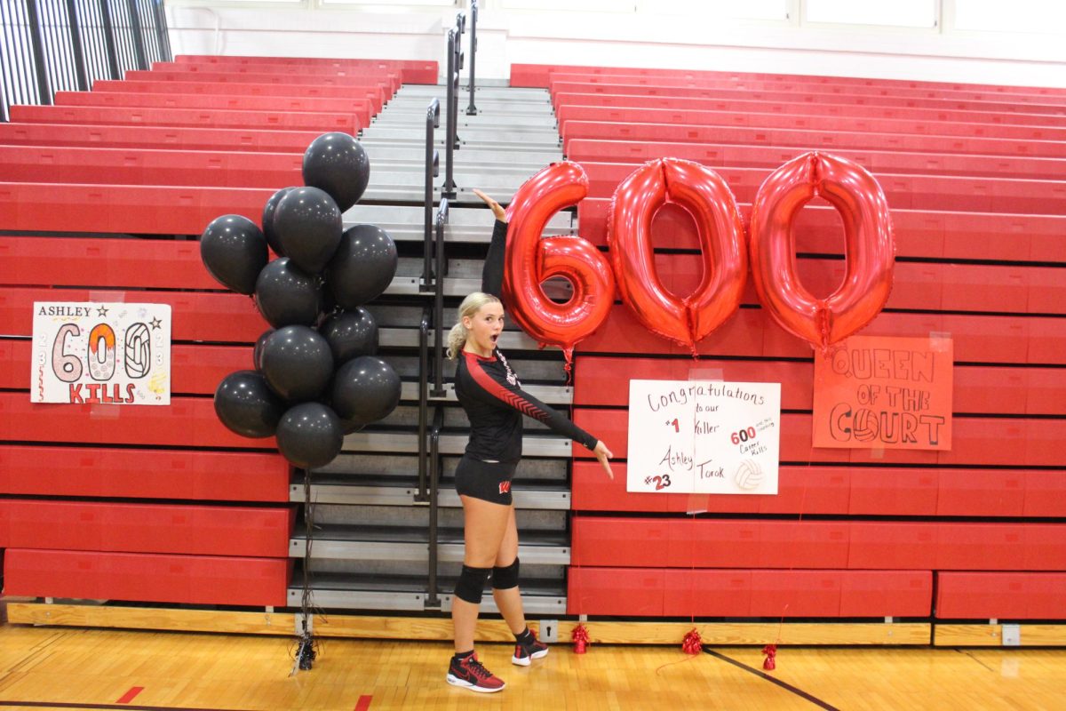 Ashley Torok celebrating her 600 kill high school career