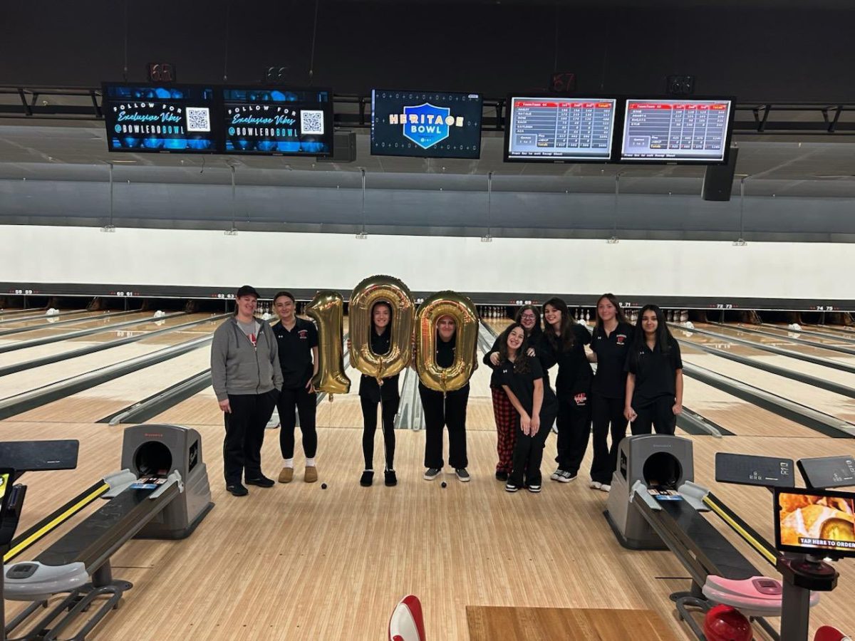 Coach Small stands with her team after her 100th career girls bowling victory

Photo Credit: @msdercole on X