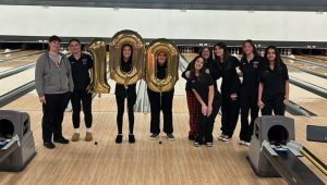 Coach Small stands with her team after her 100th career girls bowling victory

Photo Credit: @msdercole on X